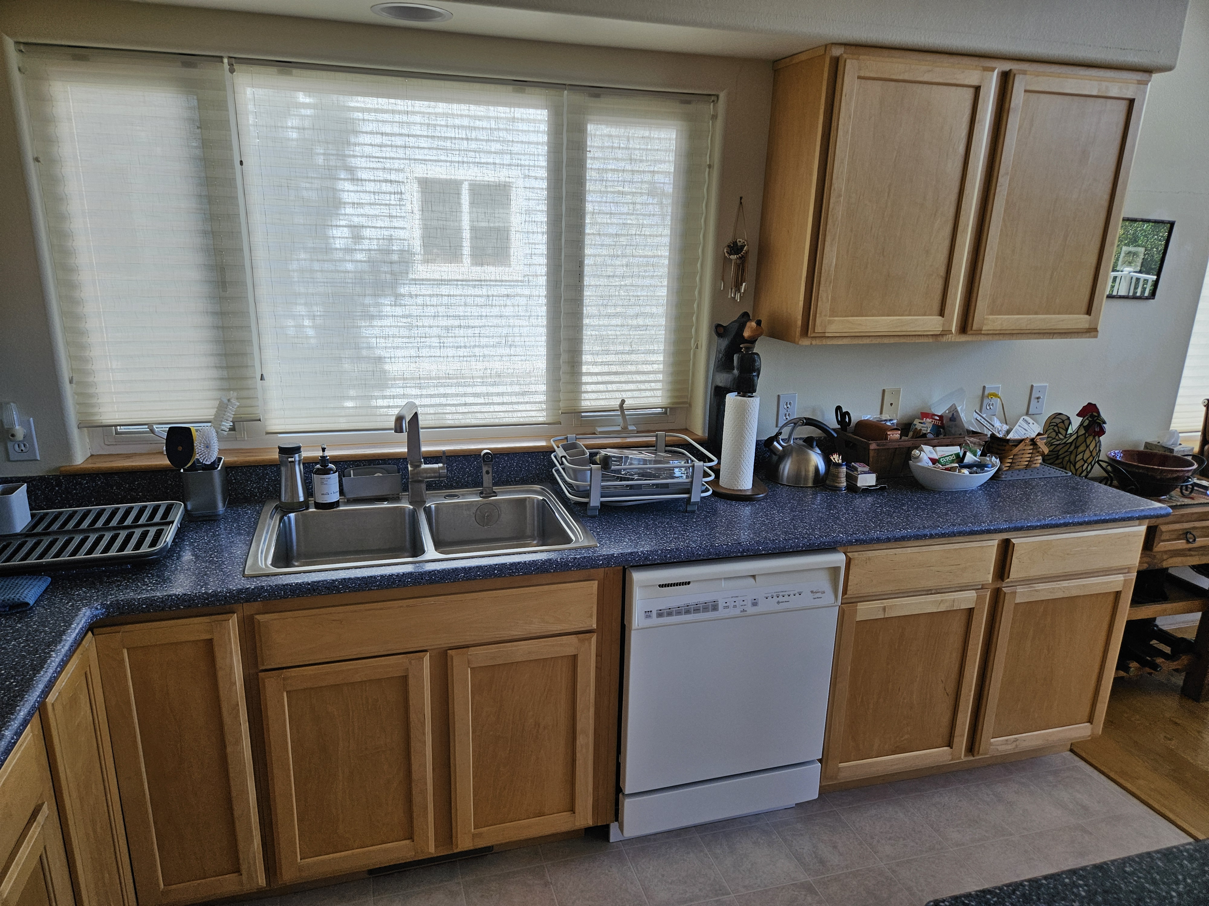 Before photo showing original kitchen before custom cabinetry